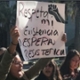 Youth activists hold signs in Spanish